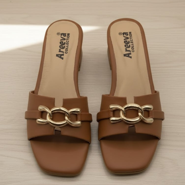 Pair of brown sandals with gold chain detail on a beige surface, featuring the Areeva Collection logo.