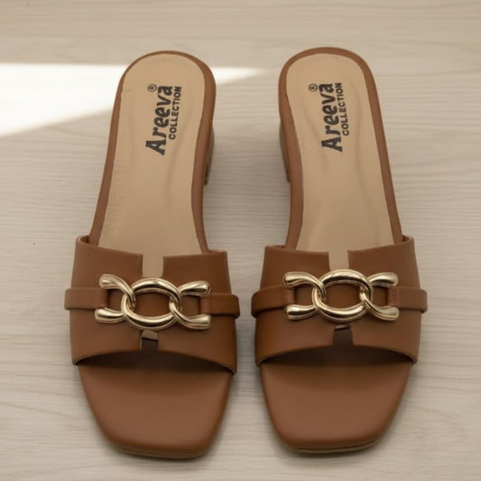 Pair of brown sandals with gold chain detail on a beige surface, featuring the Areeva Collection logo.