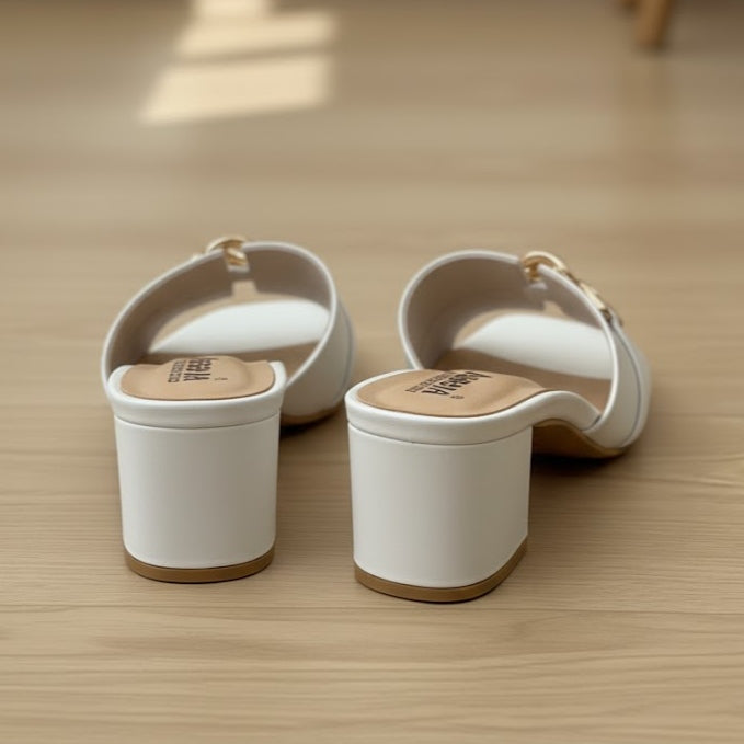 Two white containers with wooden lids on a wooden surface