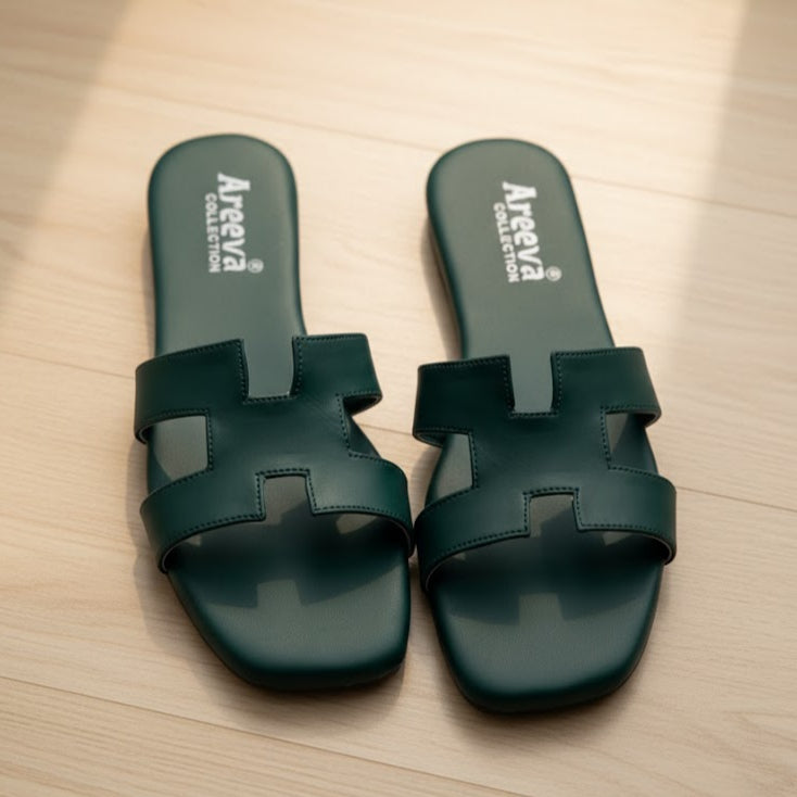 Green slides with 'Areeva Collection' branding on a wooden surface