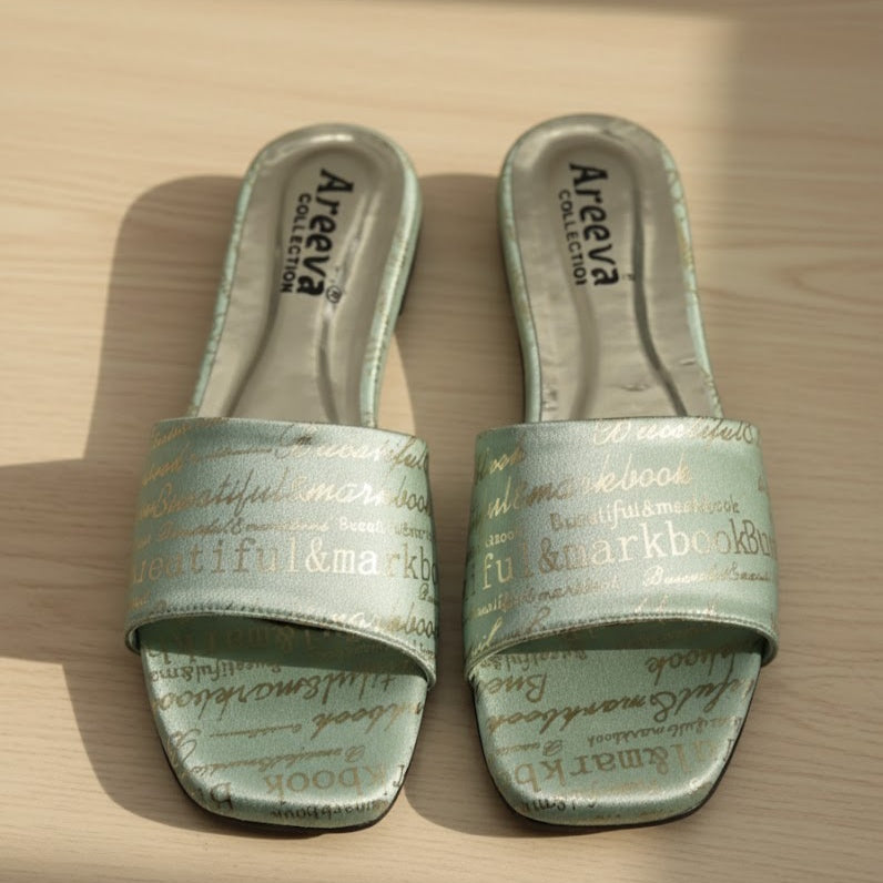 Pair of green slides with text on a wooden surface