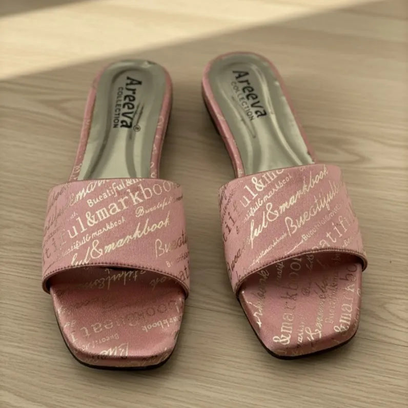 Pink slides with text on a wooden surface